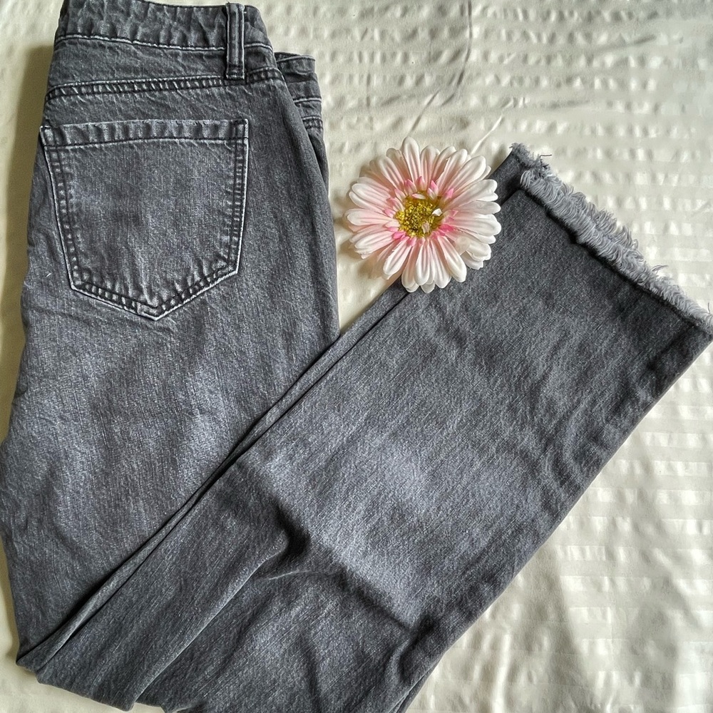 Black acid washed ripped jeans